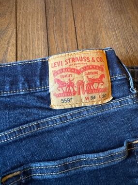 Levi's Men's 559 Relaxed Jeans in Indigo Blue with Tan Patch